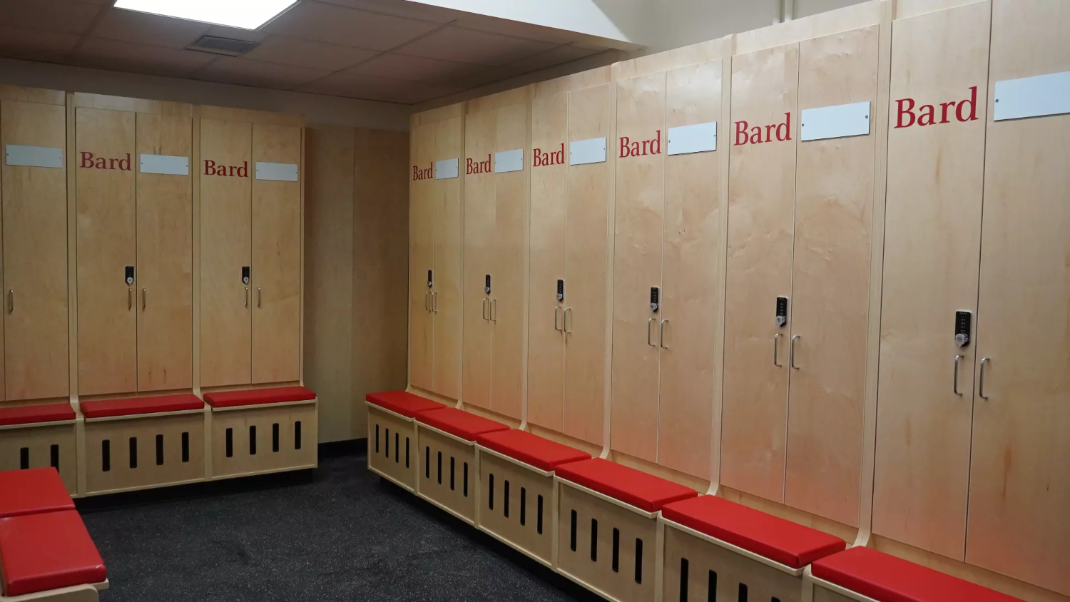 Wide view of team locker room with matching lockers and layout flow