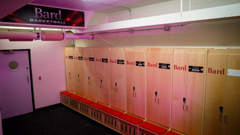 Close-up of double-door locker with nameplate and team branding