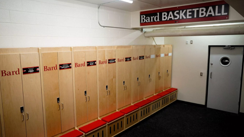 Row of custom wood lockers with integrated bench seating at BARD